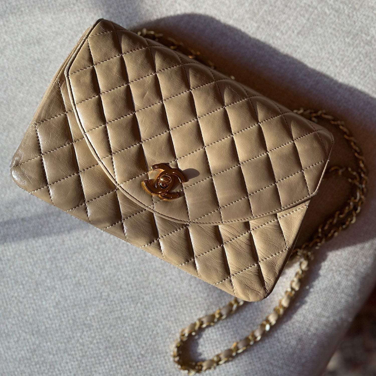 CHANEL Vintage Half Moon Shoulder Bag Beige Quilted Leather Gold Hardware  1980s - Chelsea Vintage Couture