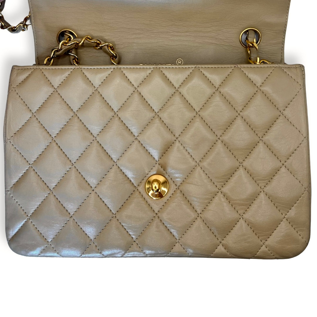 CHANEL Vintage Half Moon Shoulder Bag Beige Quilted Leather Gold Hardware  1980s - Chelsea Vintage Couture