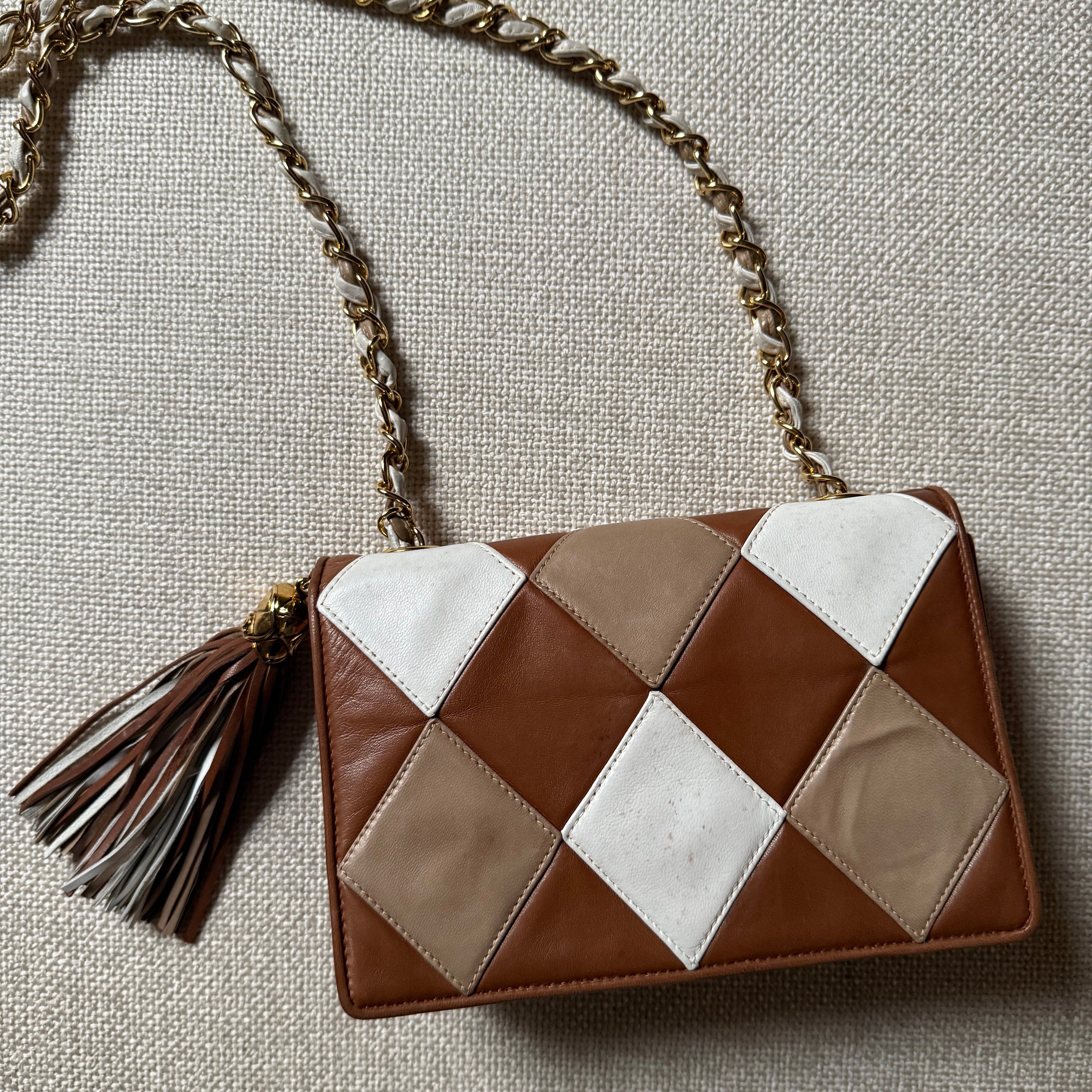 Chanel Vintage 90s authentic front flap shoulder bag cognac brown and white diamond pattern with tassel
